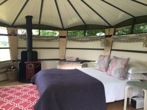 Fingle Caban interior with double bed and woodstove